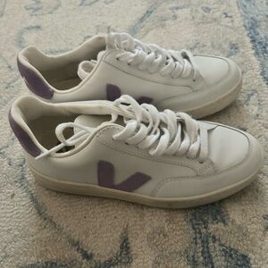 Veja sneakers with purple accents.